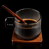 Clear glass mug with wooden handle and coaster on a white background, branded 'BenRussell'.