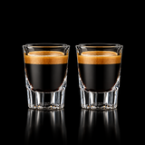 Two clear glass coffee ounces measuring shot glasses filled with espresso, shown side by side on a white background with a blue border and the Binco logo in the top left.