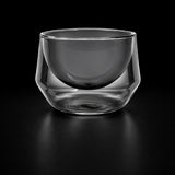 An ash gray double-walled glass cup with a rounded, wide shape, shown on a white background with teal text below reading 'Ash Gray 250 mL' and 'Height 76 mm, Diameter 95 mm'.